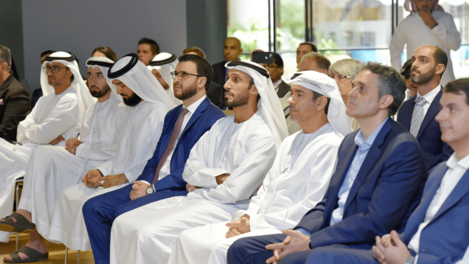 Group of people watching a presentation