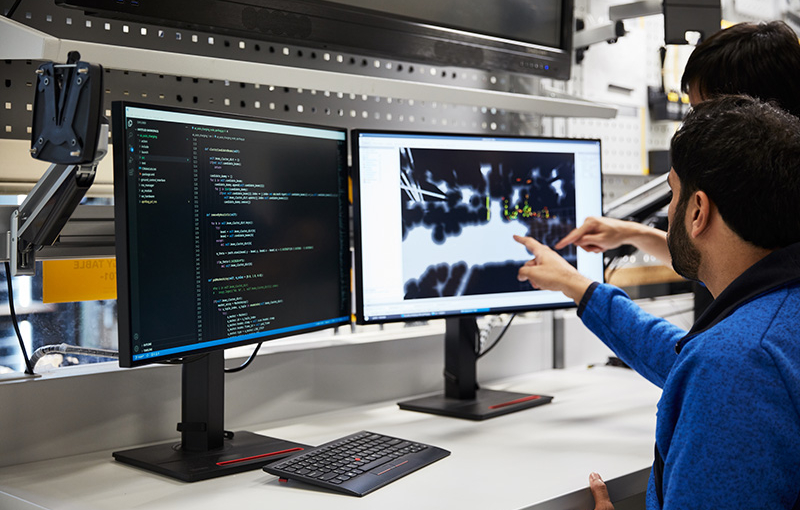 Robotics engineers working in labs